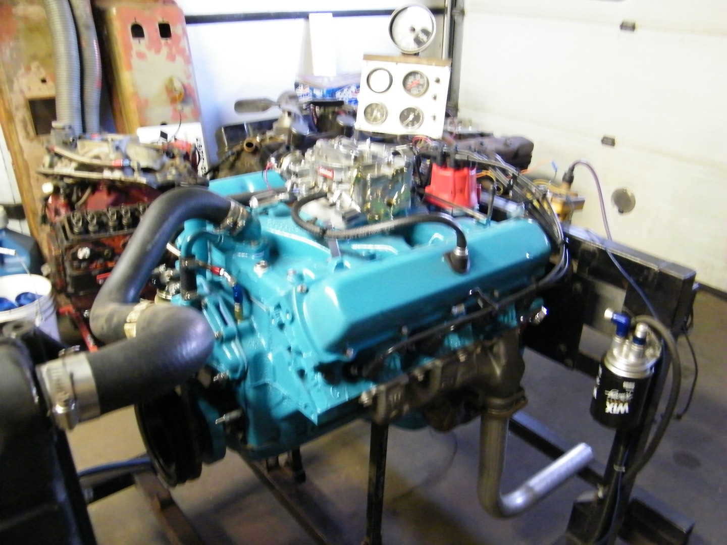 Turquoise engine on test stand workbench